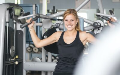 Attractive Young Female Exercising In A Gym